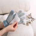 Cat being groomed with the PawSheen deshedding glove